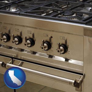 a stainless steel gas range and oven - with California icon