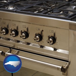 a stainless steel gas range and oven - with North Carolina icon