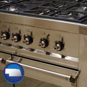 a stainless steel gas range and oven - with Nebraska icon